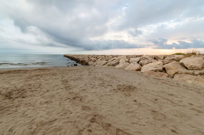 Scenic view of sea against cloudy sky