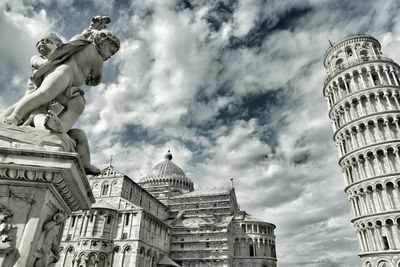 Low angle view of building against cloudy sky