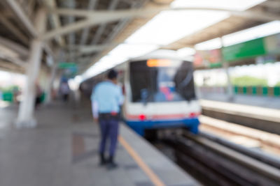 Blurred motion of train at railroad station platform