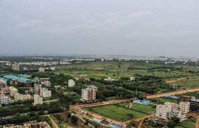 High angle view of buildings in city against sky