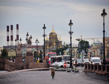 City street and buildings against sky