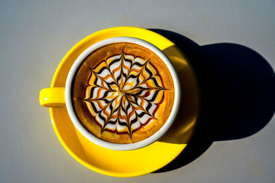 High angle view of coffee cup on table