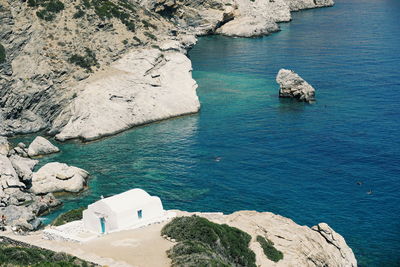 High angle view of rock formation by sea