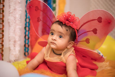 Cute girl in fairy costume at home