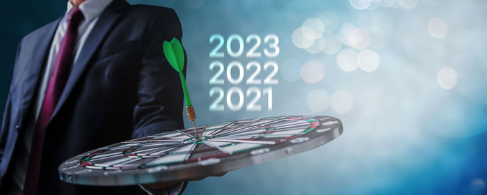 Midsection of businessman using mobile phone