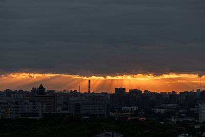 Cityscape against sky during sunset