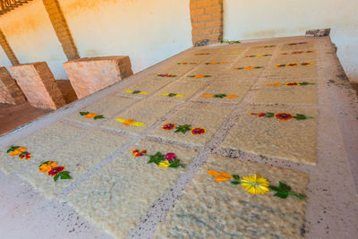 Yellow flowers on wall