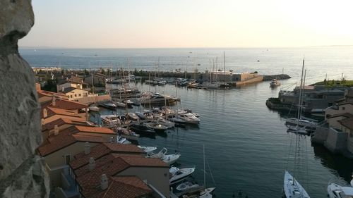 High angle view of sea against sky at sunset