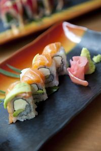 Close-up of sushi in plate on table by maki mono