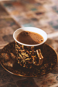 Close-up of coffee cup on table