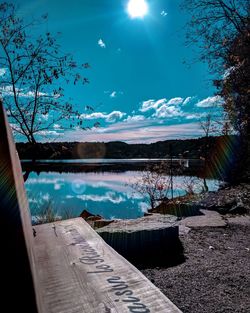 Scenic view of swimming pool by lake against sky