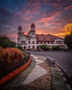 Historic building against cloudy sky during sunset