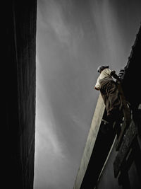 Low angle view of statue against building