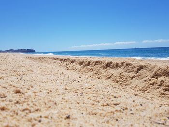 Surface level of beach against sky