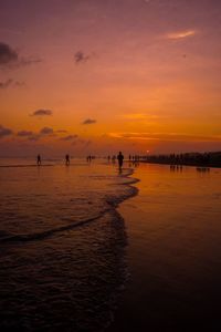 Scenic view of sea against orange sky