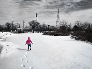 People standing on snow covered landscape