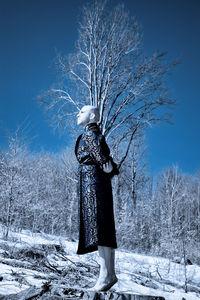 Man standing on snow covered field