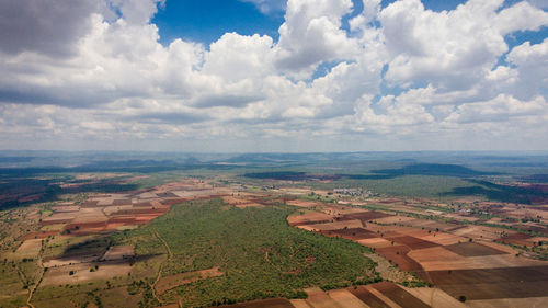 Aerial view of agricultural field against sky