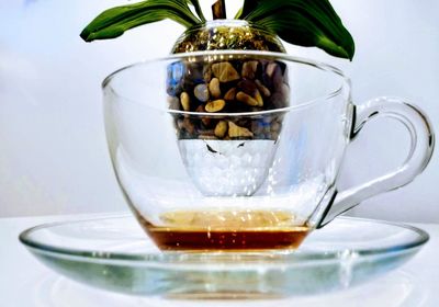 Close-up of coffee in glass on table