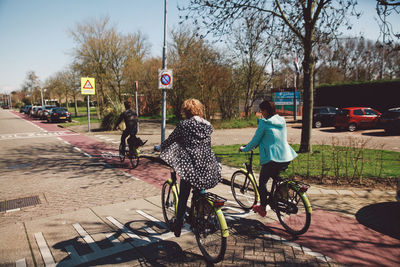 People riding bicycles