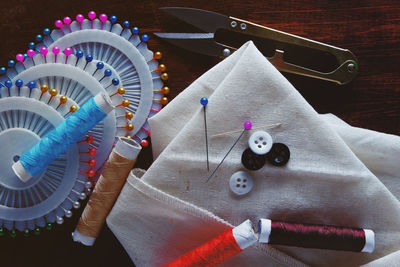 Close-up of sewing items on table