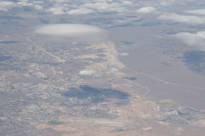 Aerial view of agricultural field against sky