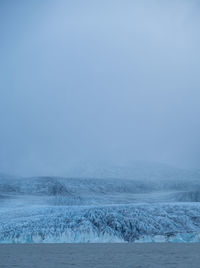 Scenic view of sea against clear sky during winter