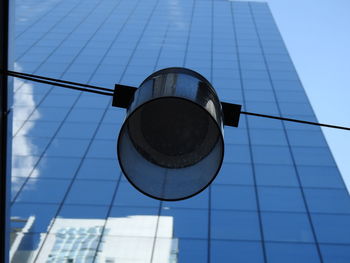 Low angle view of modern building against blue sky
