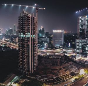 High angle view of illuminated buildings in city at night