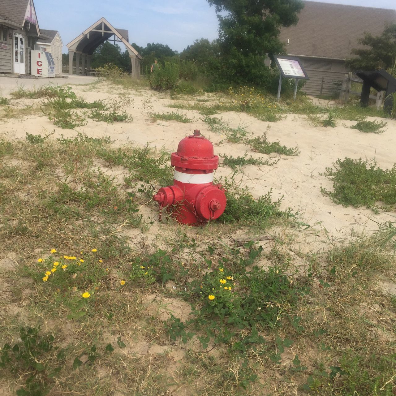 CLOSE-UP OF RED FIRE HYDRANT AGAINST SKY