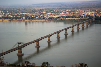 High angle view of river amidst buildings against sky