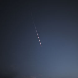 Low angle view of vapor trails in sky