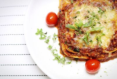 Directly above shot of lasagna served on table