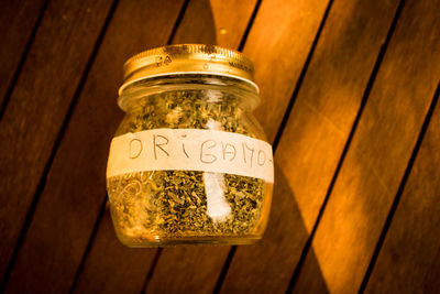 High angle view of glass of jar on table