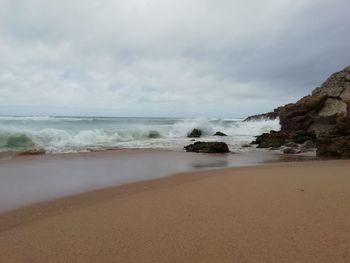 Scenic view of beach against sky