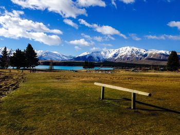 Scenic view of lake against cloudy sky