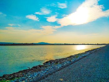 Scenic view of beach against sky during sunset