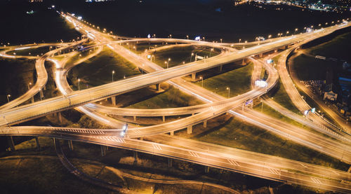 High angle view of light trails on city street at night