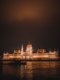 Illuminated city at waterfront