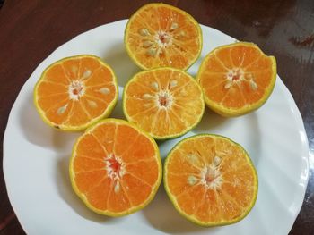 High angle view of orange fruits on table