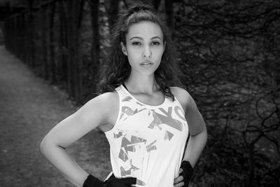 Portrait of young woman standing outdoors