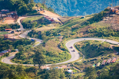 High angle view of highway amidst trees in city