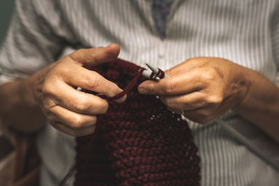 Close-up of man holding hands