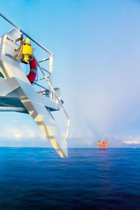 Ship in sea against sky