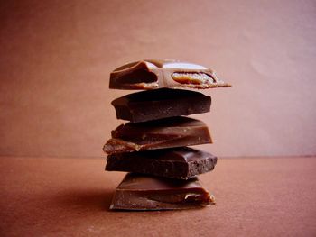 Close-up of stacked chocolates on table