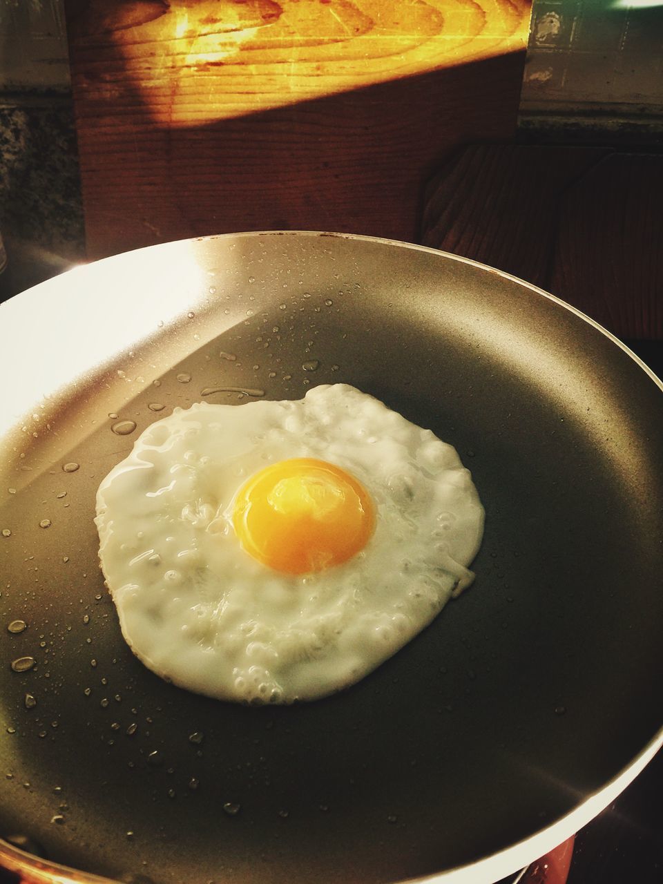 CLOSE-UP OF EGG IN PAN