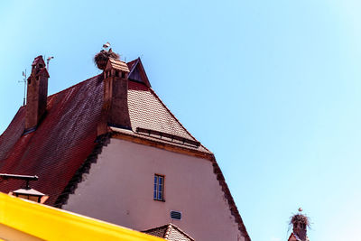 Low angle view of traditional building against clear blue sky