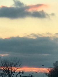 Low angle view of silhouette trees against sky at sunset