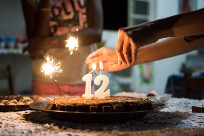 Close-up of hand holding cake