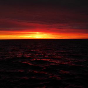 Scenic view of sea against dramatic sky